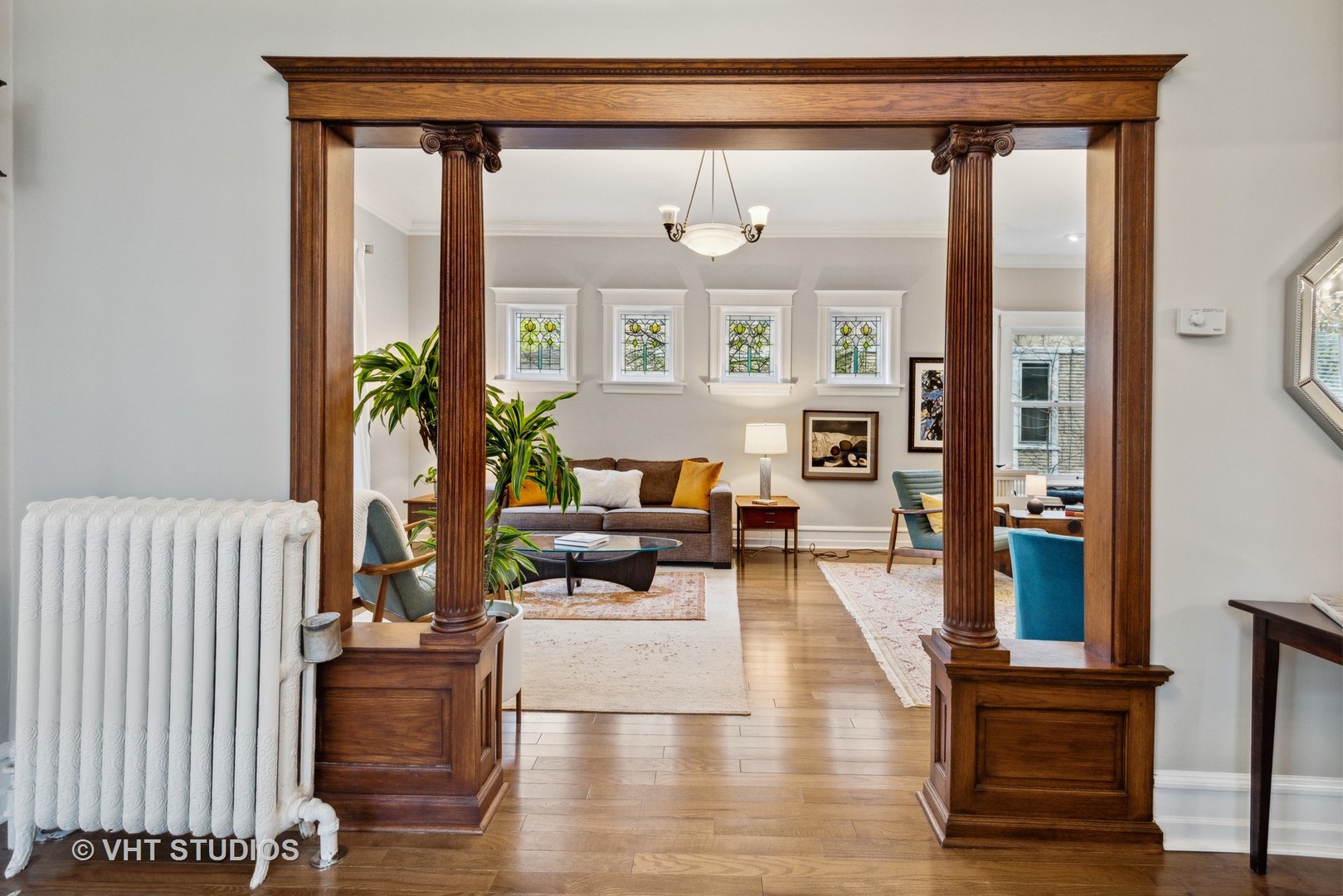 1224 Maple Avenue Evanston, IL 60202 - Photo 10 of 71 a living room with furniture and a large mirror next to a window