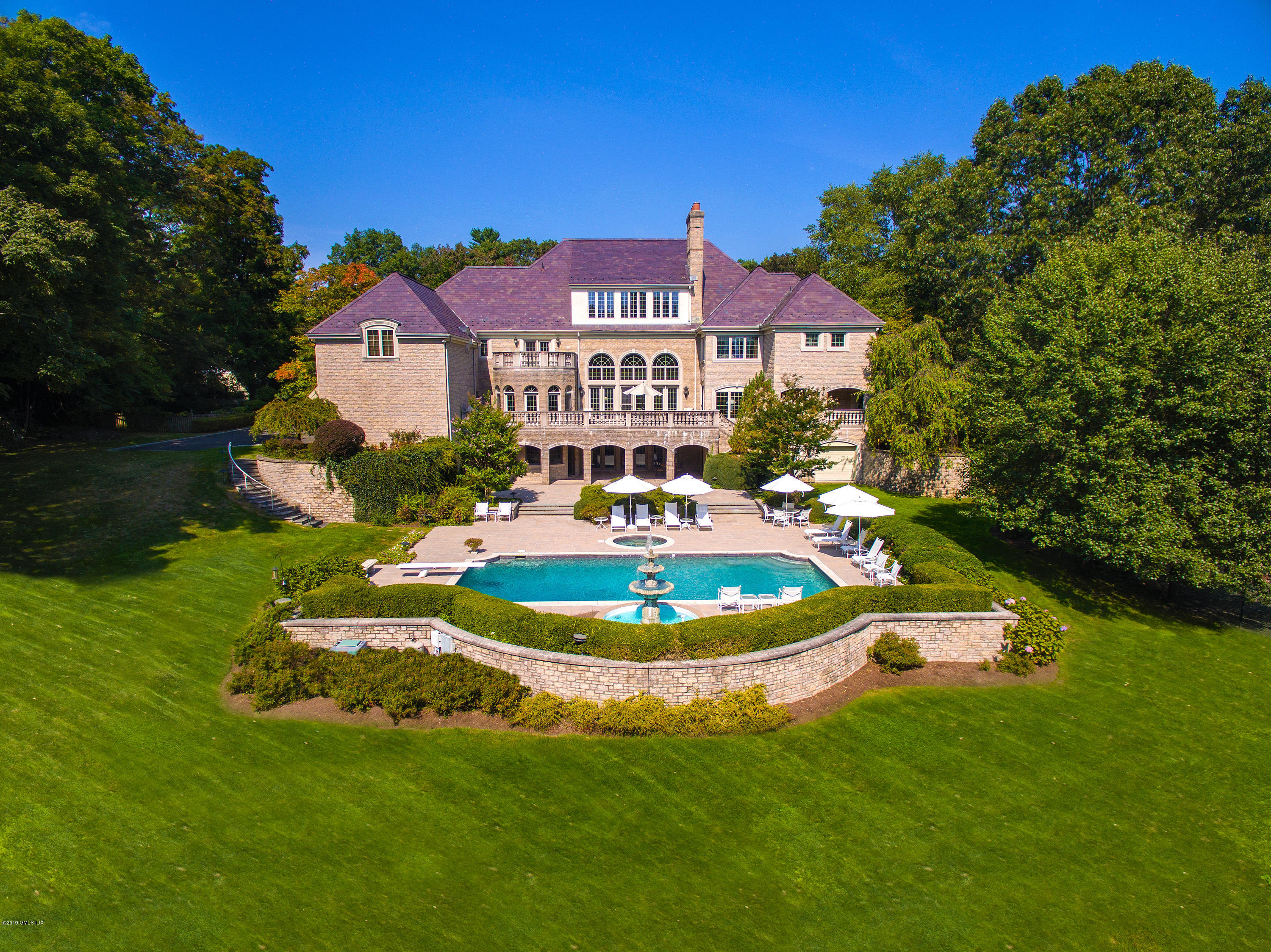 56 North Stanwich Road Greenwich, CT 06831 - Photo 1 of 30 a front view of a house with a yard