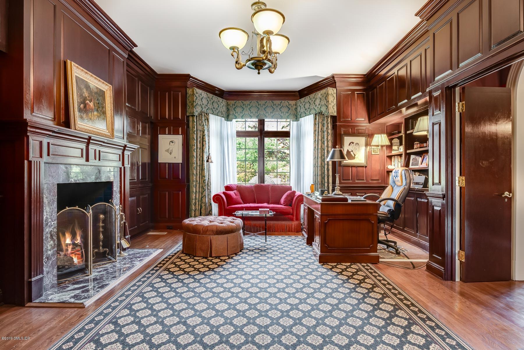 56 North Stanwich Road Greenwich, CT 06831 - Photo 12 of 30 a living room with furniture a chandelier and a fireplace