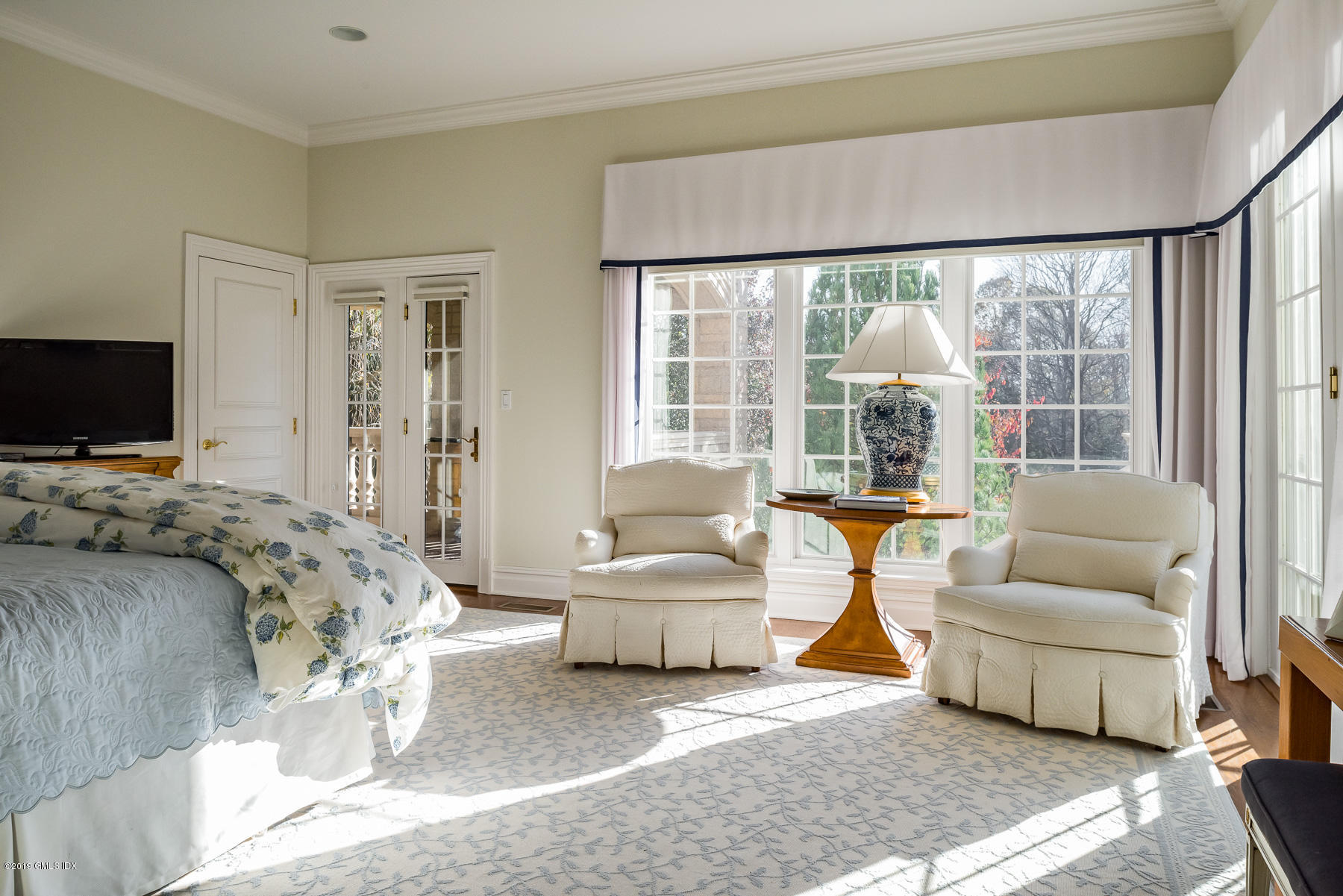 56 North Stanwich Road Greenwich, CT 06831 - Photo 16 of 30 a bedroom with a bed and a couch