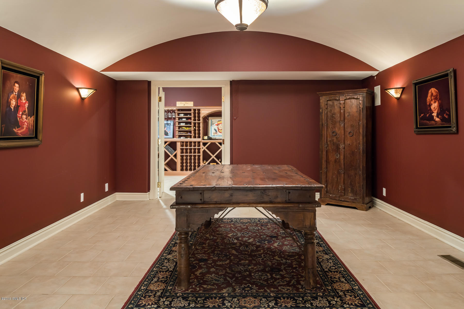 56 North Stanwich Road Greenwich, CT 06831 - Photo 18 of 30 a bedroom with a bed and a table