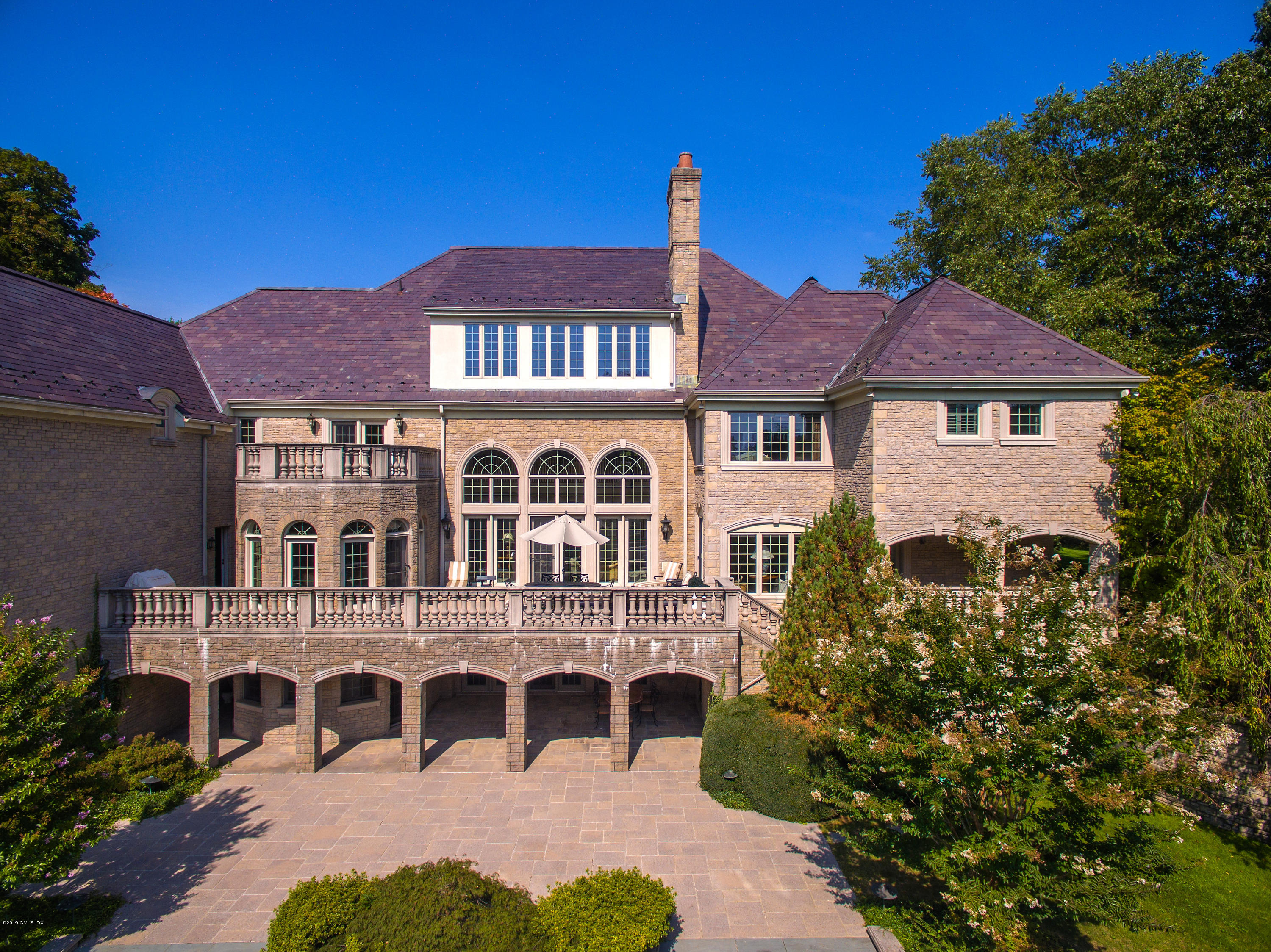 56 North Stanwich Road Greenwich, CT 06831 - Photo 24 of 30 a front view of a house with a yard