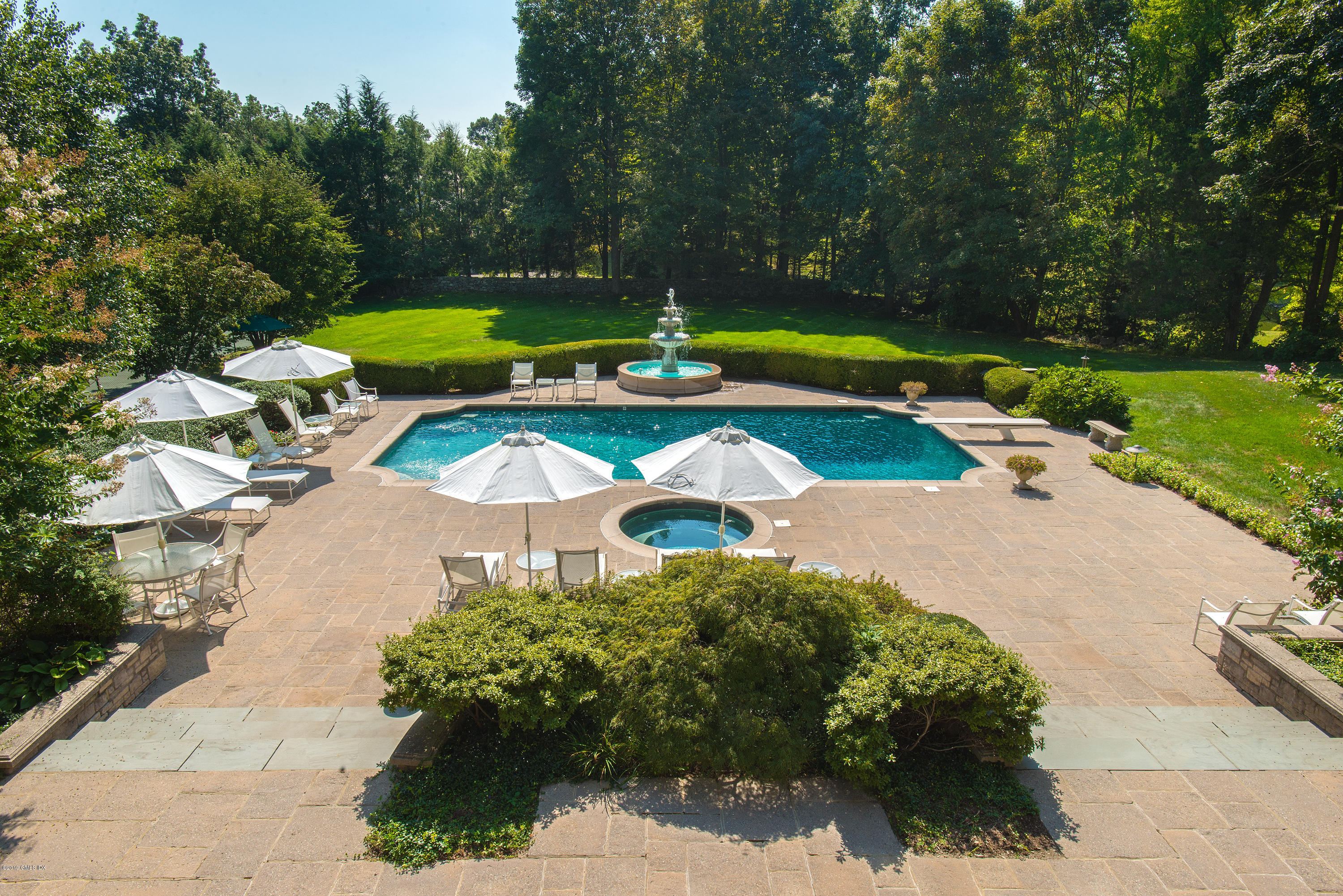 56 North Stanwich Road Greenwich, CT 06831 - Photo 26 of 30 an aerial view of a house with garden space and trees