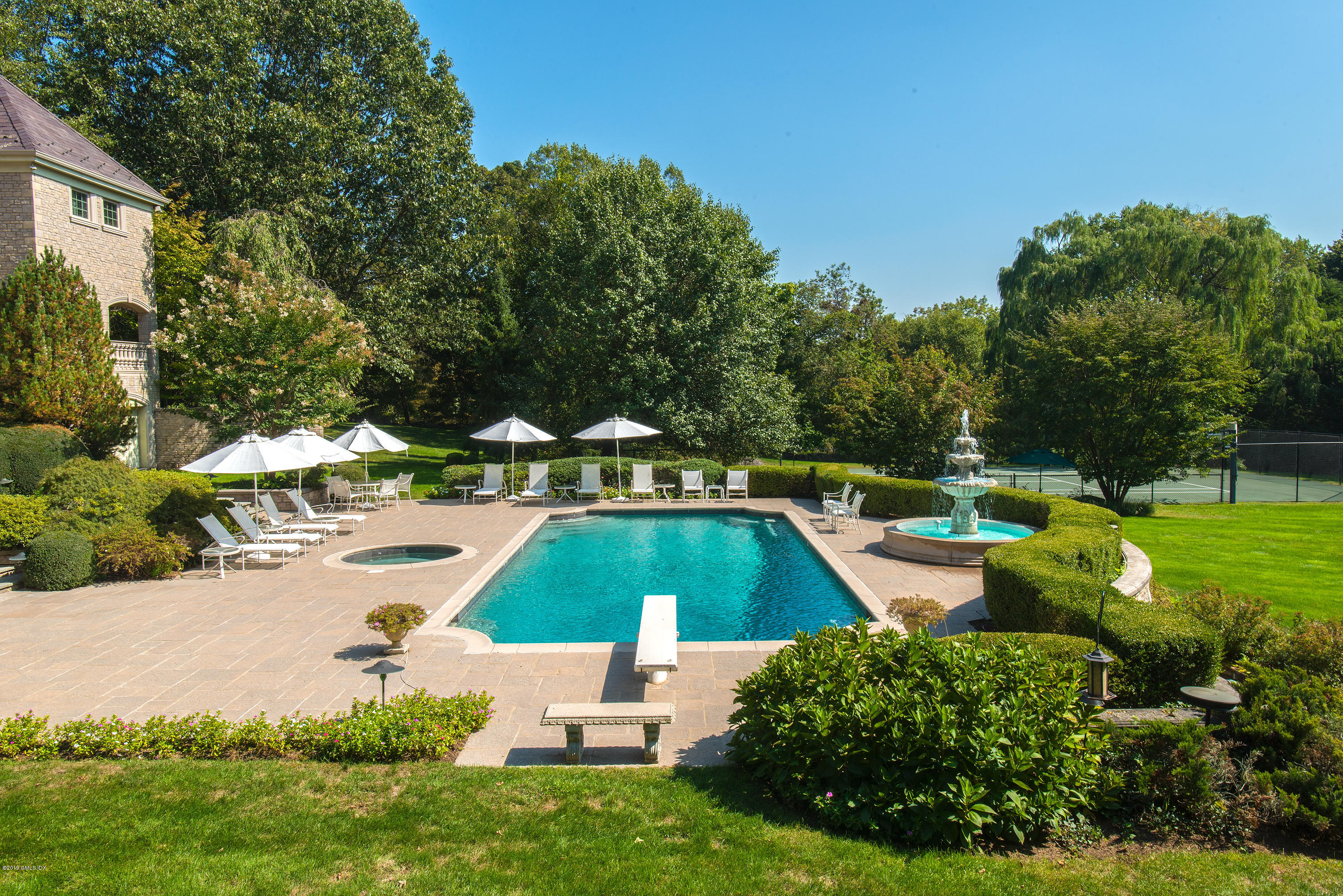 56 North Stanwich Road Greenwich, CT 06831 - Photo 27 of 30 a view of a swimming pool with lounge chair