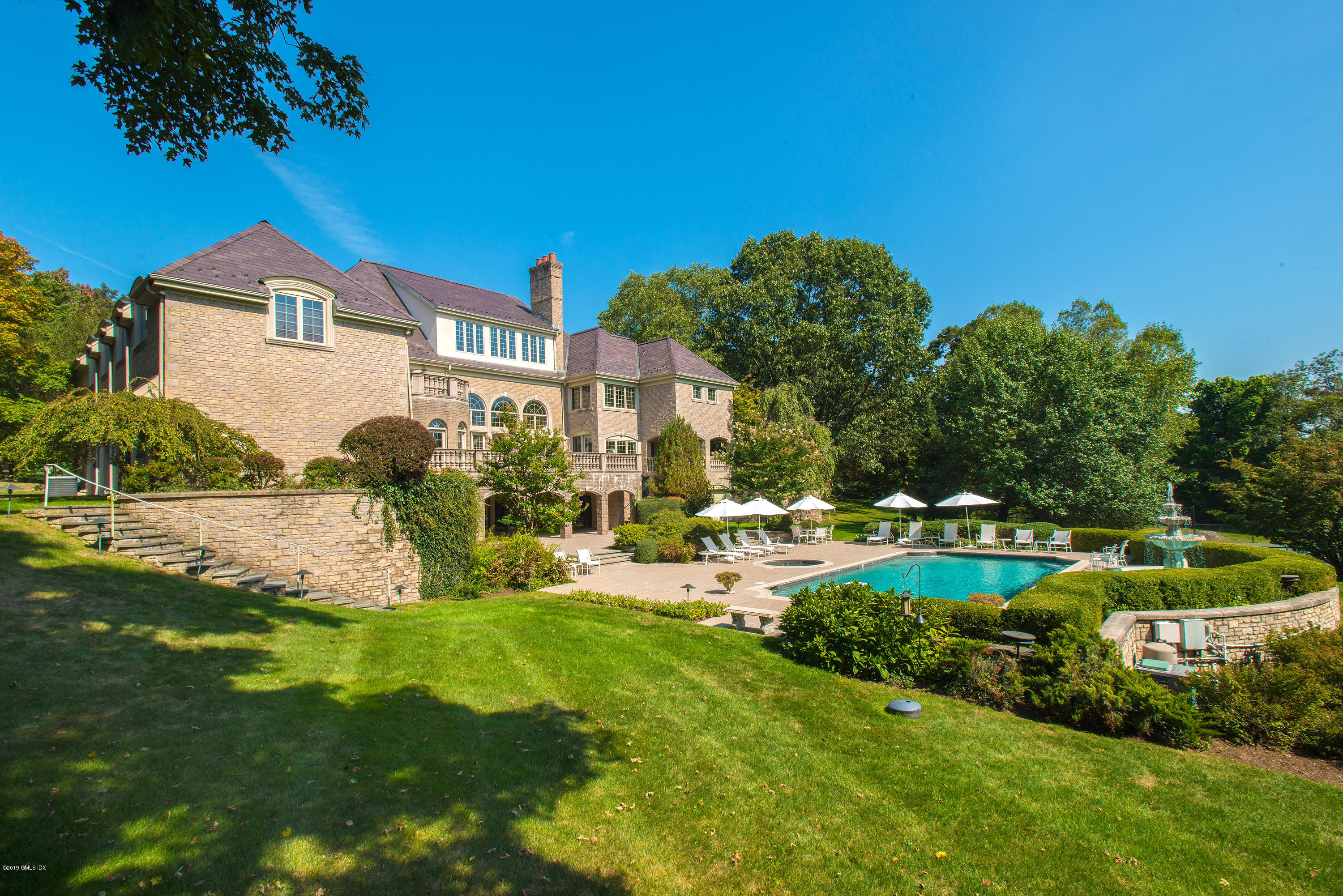 56 North Stanwich Road Greenwich, CT 06831 - Photo 29 of 30 a view of a house with a yard and sitting area