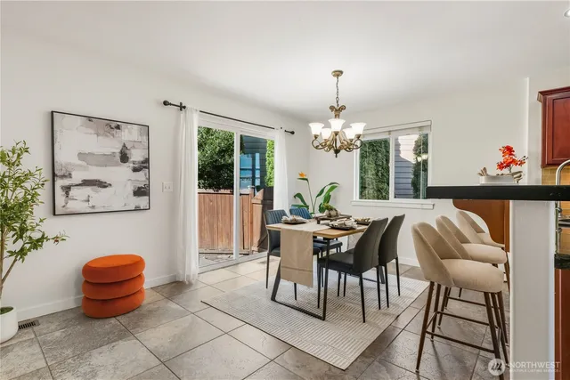 a dining room with furniture a livingroom and chandelier