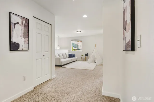 a spacious bedroom with a bed and a couch