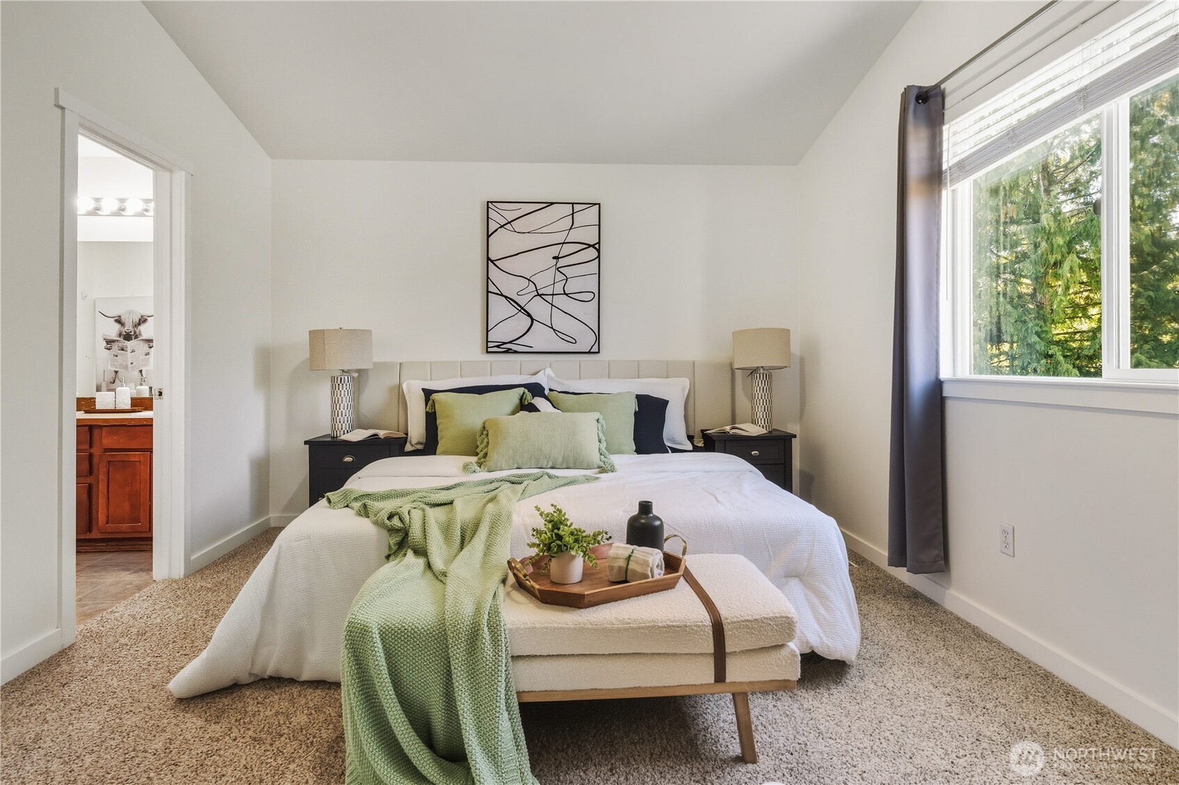 18312 8th Avenue Southeast Bothell, WA 98012 - Photo 19 of 39 a bed sitting in a bedroom next to a window