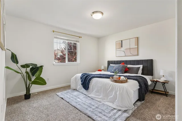 a bedroom with bed and a window