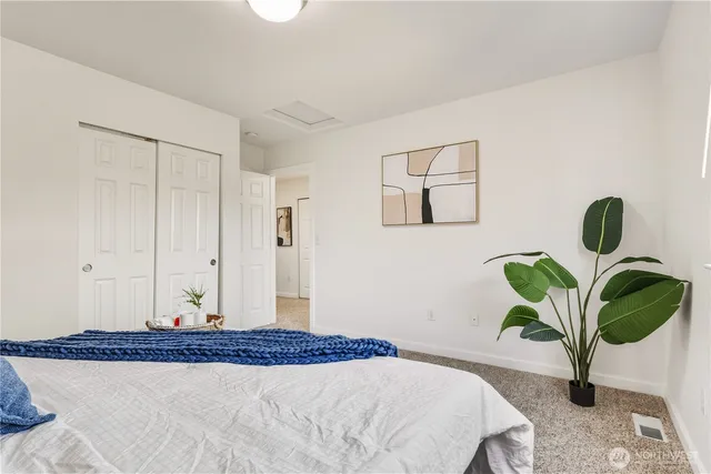 a bedroom with a bed a chandelier
