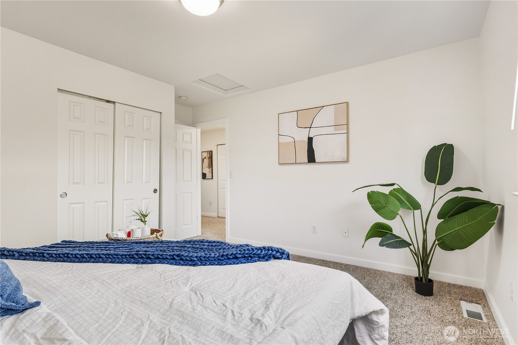 18312 8th Avenue Southeast Bothell, WA 98012 - Photo 24 of 39 a bedroom with a bed a chandelier