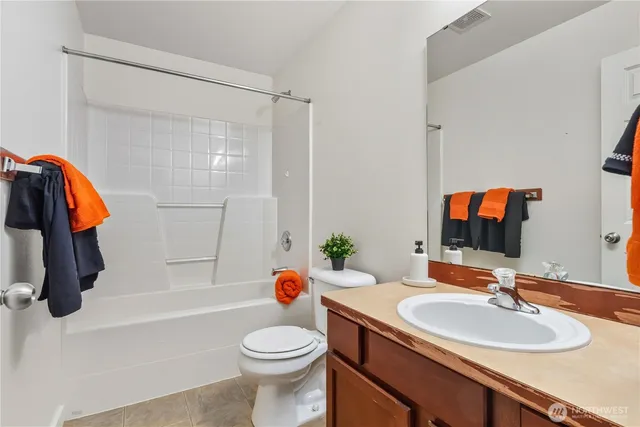 a bathroom with a sink a toilet and a bathtub