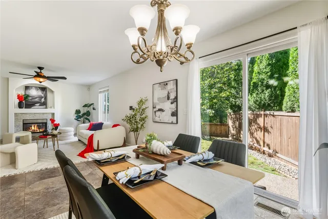 a work room with furniture chandelier and a window
