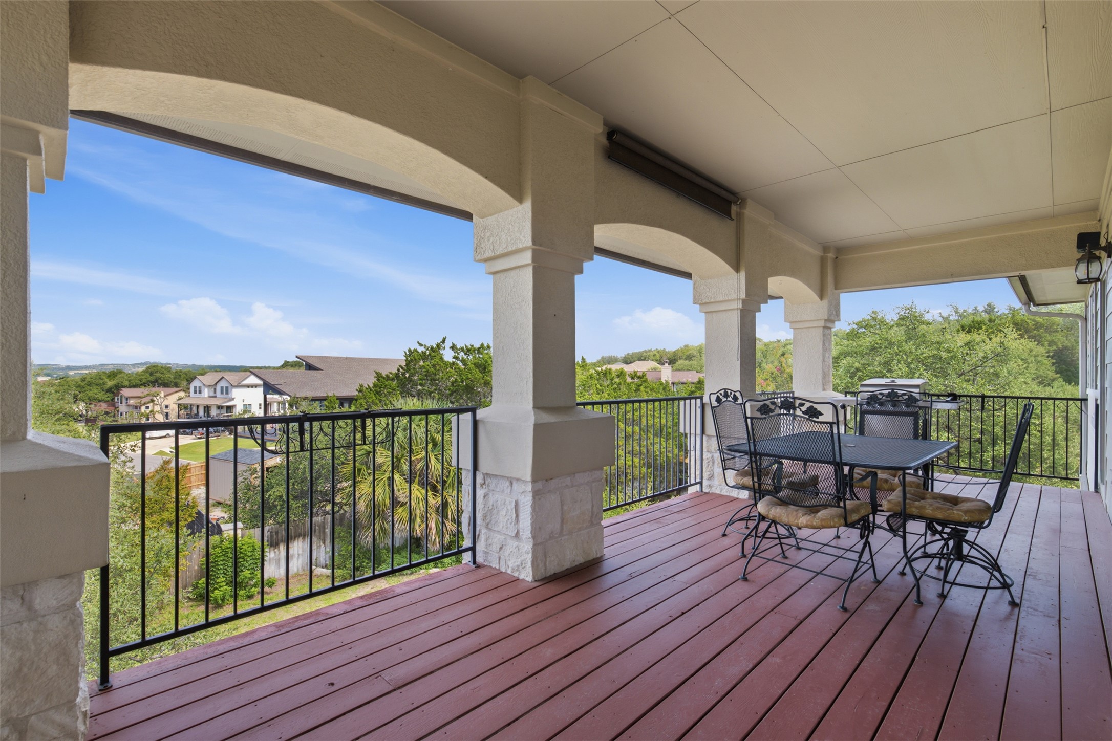 700 Augusta Circle Point Venture, TX 78645 - Photo 22 of 35 Upstairs covered deck offers ample space for al fresco dining with captivating distant views.