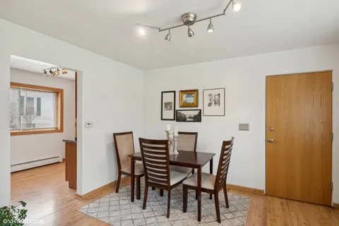 a kitchen with stainless steel appliances granite countertop a sink a stove cabinets and a refrigerator