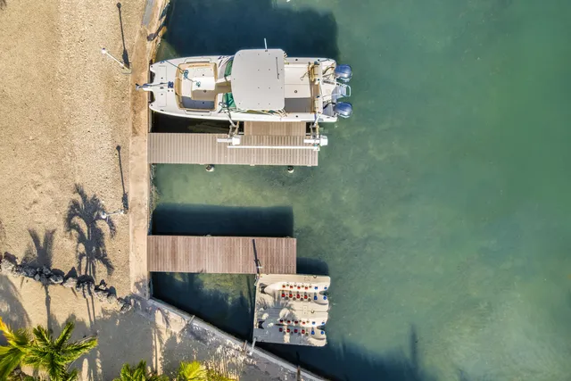 an aerial view of a house with a garden
