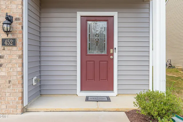 a front view of a house with garden