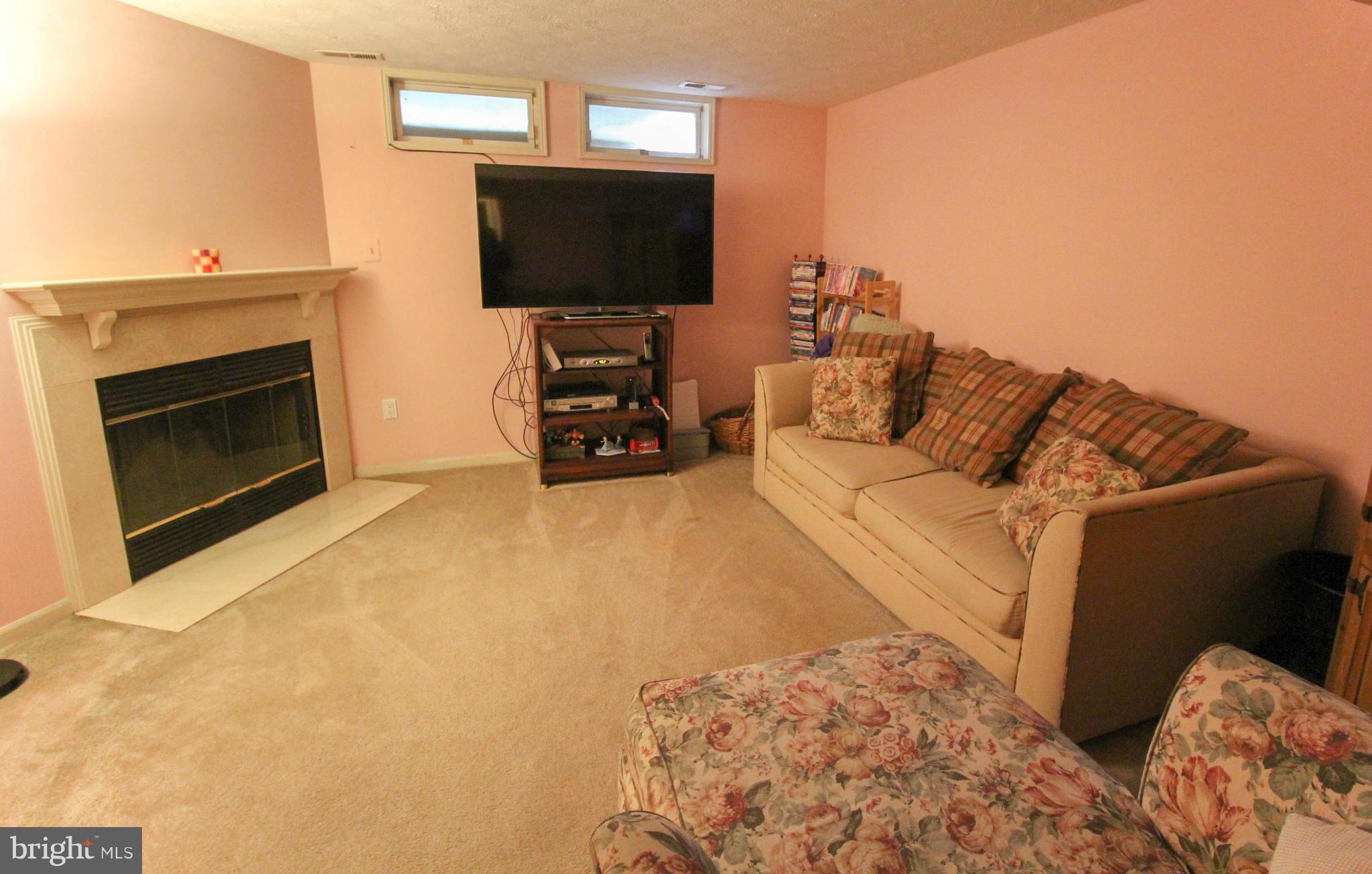 2242 Riding Crop Way Baltimore, MD 21244 - Photo 11 of 20 a living room with furniture and a flat screen tv