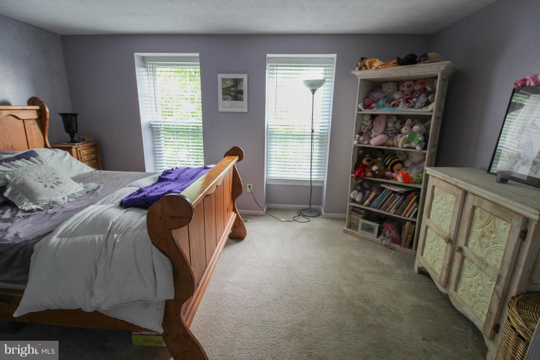 2242 Riding Crop Way Baltimore, MD 21244 - Photo 17 of 20 a bed room with a bed and a window
