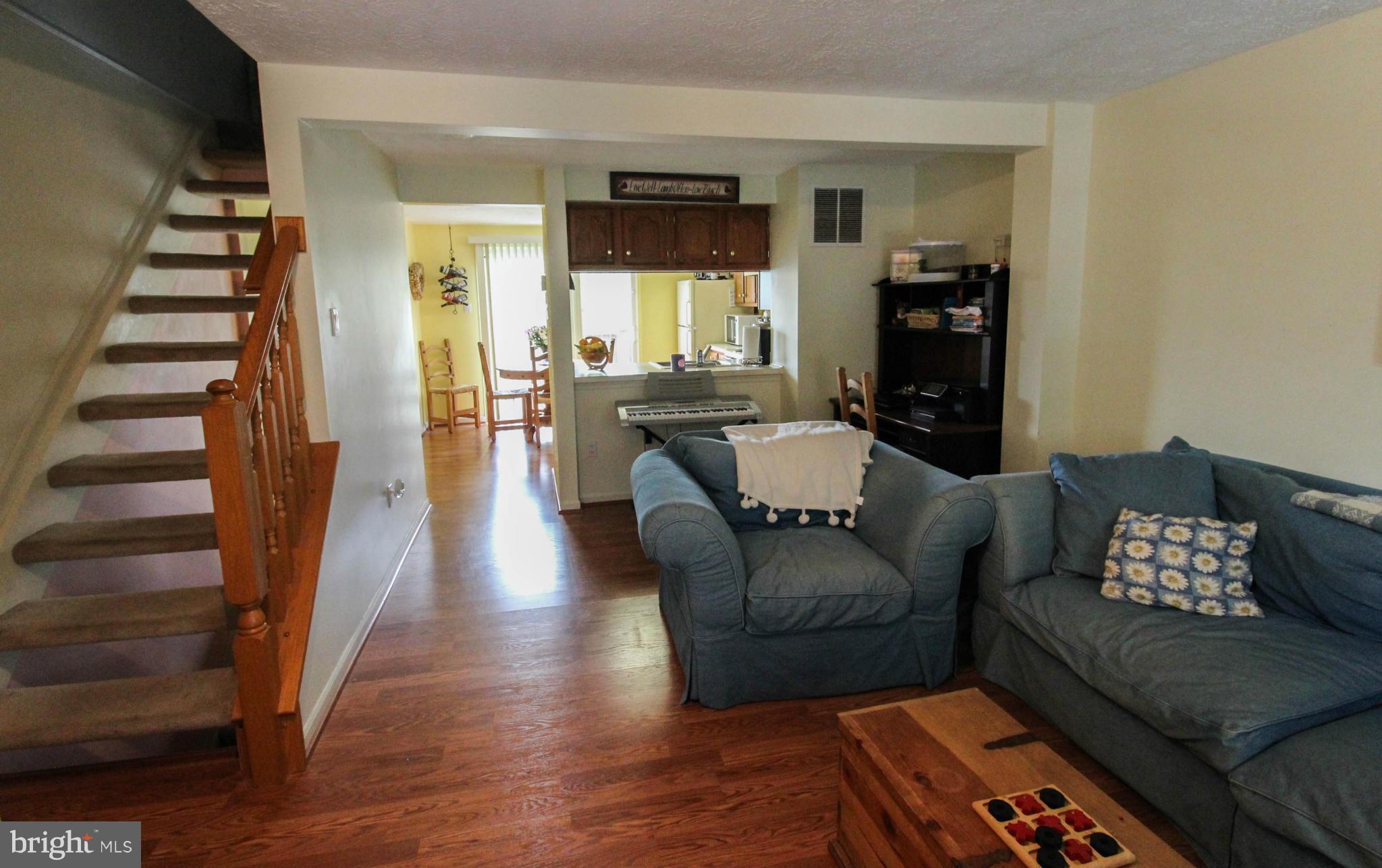 2242 Riding Crop Way Baltimore, MD 21244 - Photo 3 of 20 a living room with furniture and wooden floor