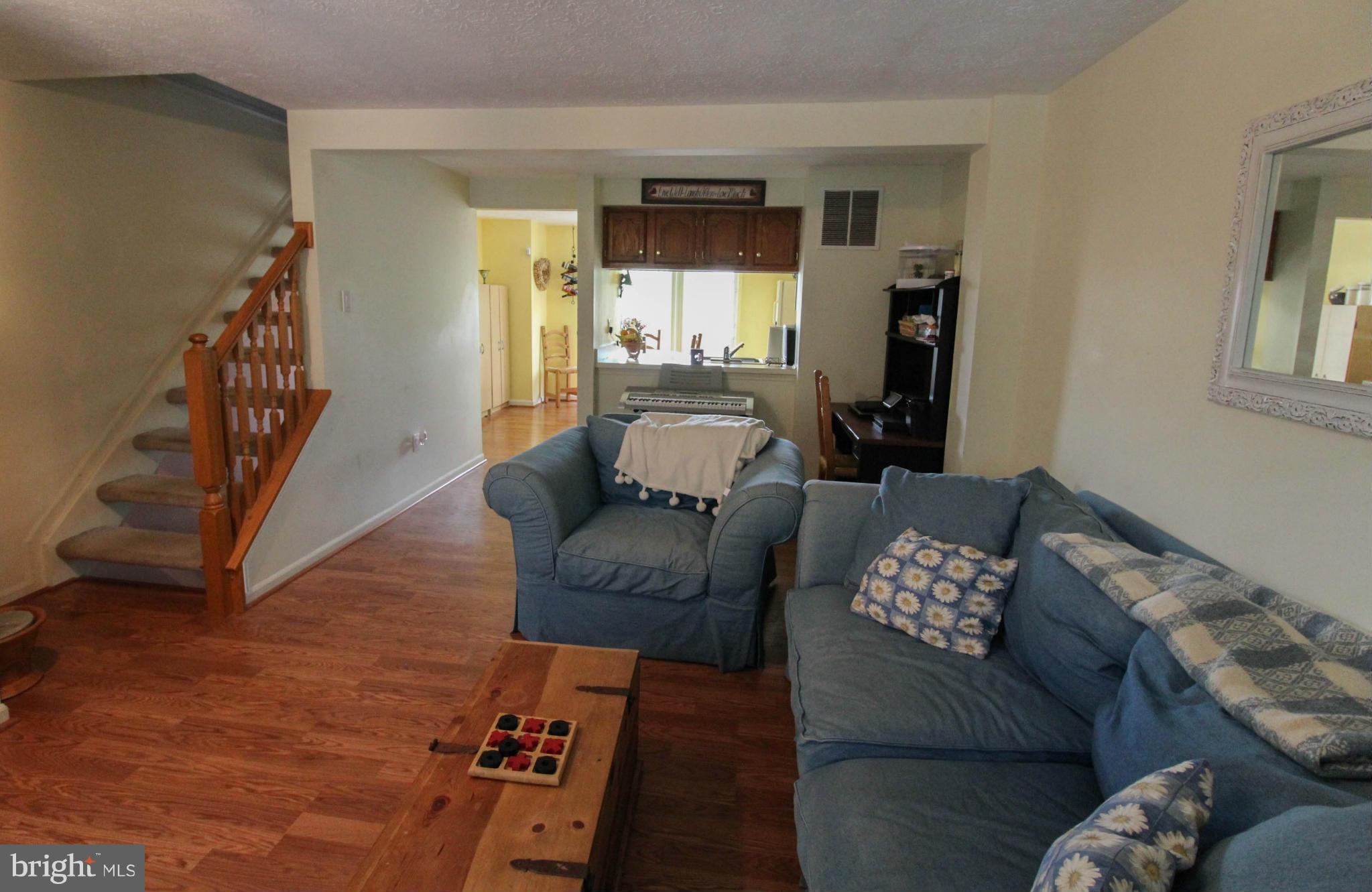 2242 Riding Crop Way Baltimore, MD 21244 - Photo 4 of 20 a living room with furniture and a wooden floor