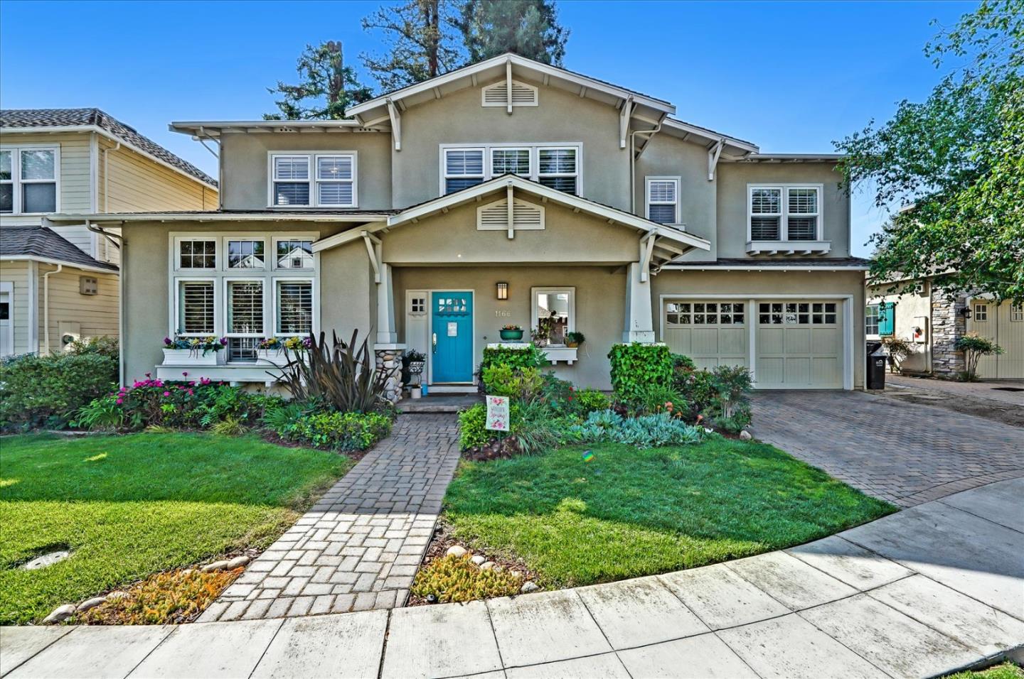 a front view of a house with garden