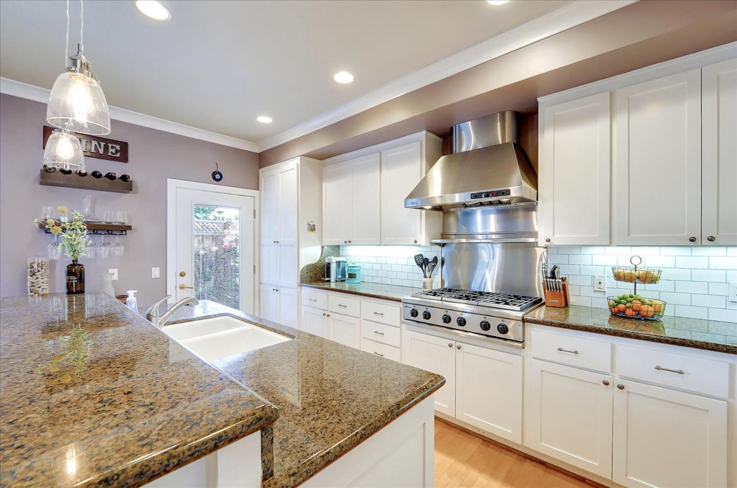 1166 Elysian Place San Jose, CA 95125 - Photo 13 of 46 a kitchen with stainless steel appliances granite countertop a sink dishwasher stove and refrigerator
