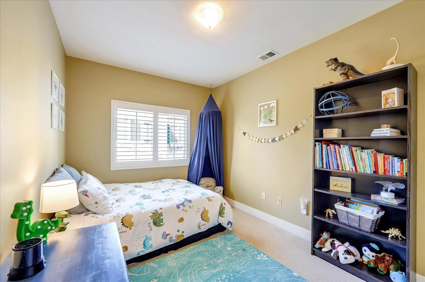 1166 Elysian Place San Jose, CA 95125 - Photo 22 of 46 a bedroom with a bed furniture and a book shelf