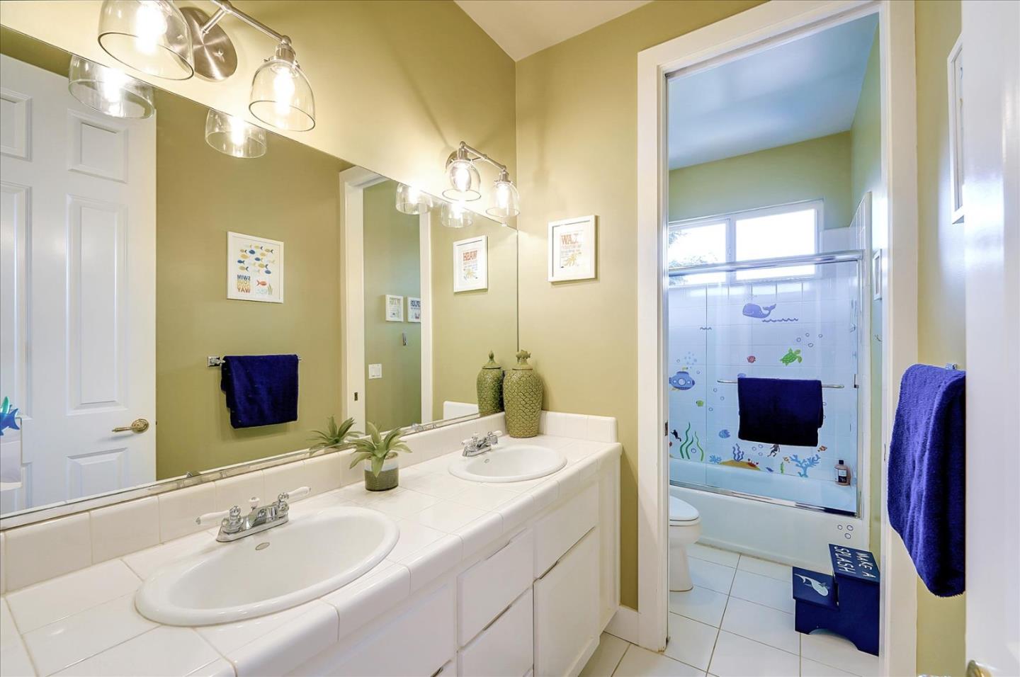 1166 Elysian Place San Jose, CA 95125 - Photo 23 of 46 a bathroom with a double vanity sink mirror and bathtub