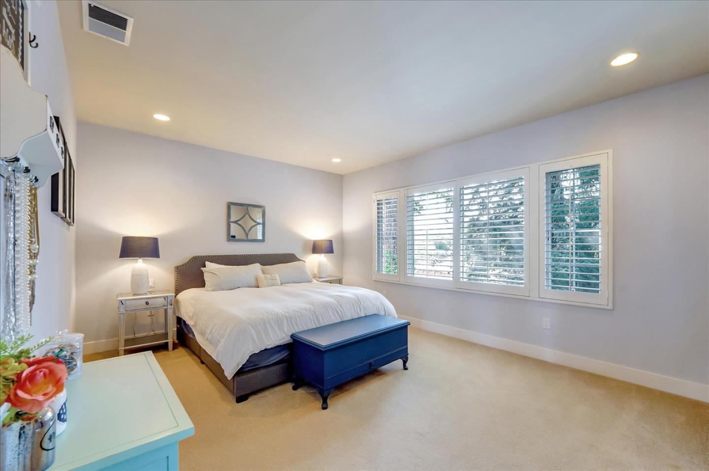 1166 Elysian Place San Jose, CA 95125 - Photo 29 of 46 a spacious bedroom with a bed a couch and a dresser next to a window