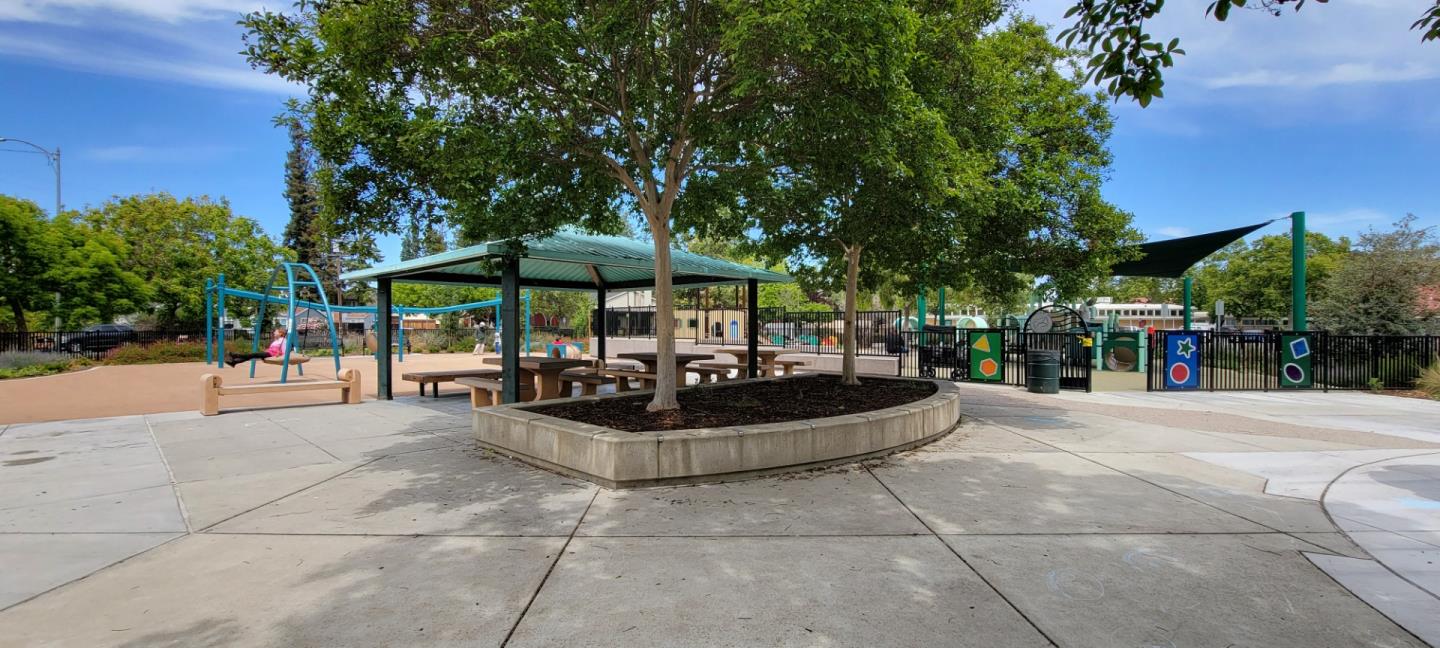 1166 Elysian Place San Jose, CA 95125 - Photo 46 of 46 a view of a patio with a dining table and chairs under an umbrella
