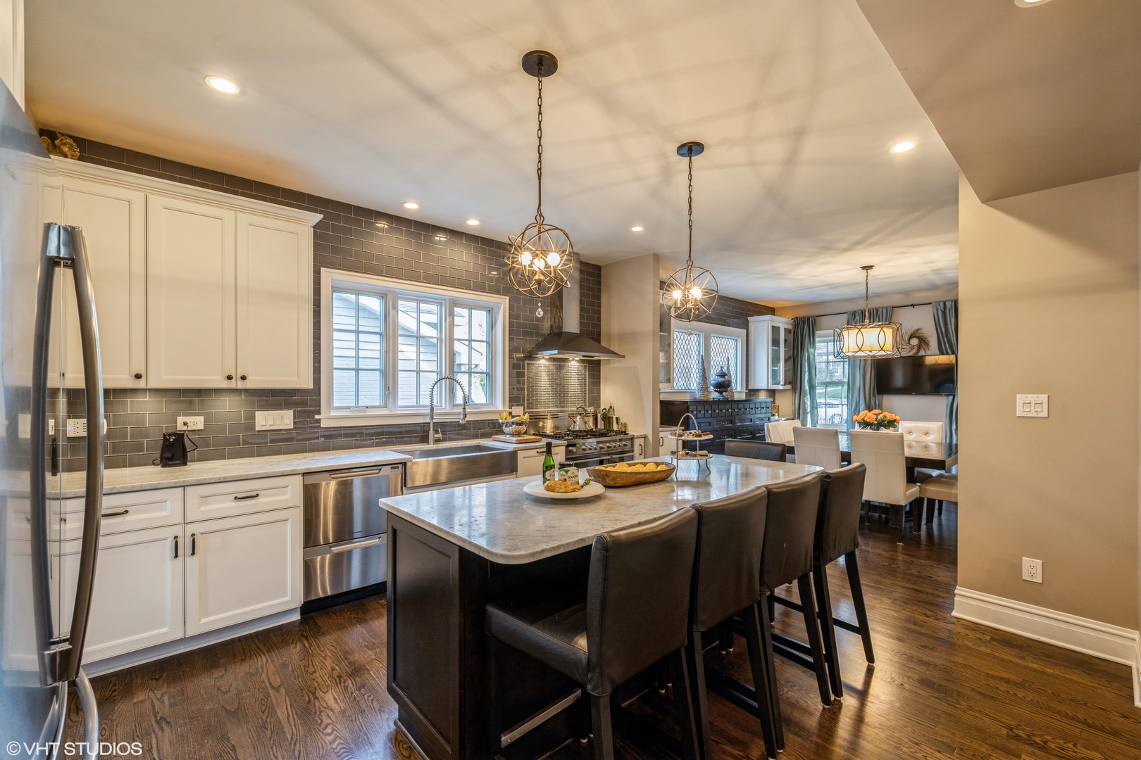 217 Ravine Road Hinsdale, IL 60521 - Photo 6 of 53 a dining table with stainless steel appliances granite countertop a stove and kitchen view