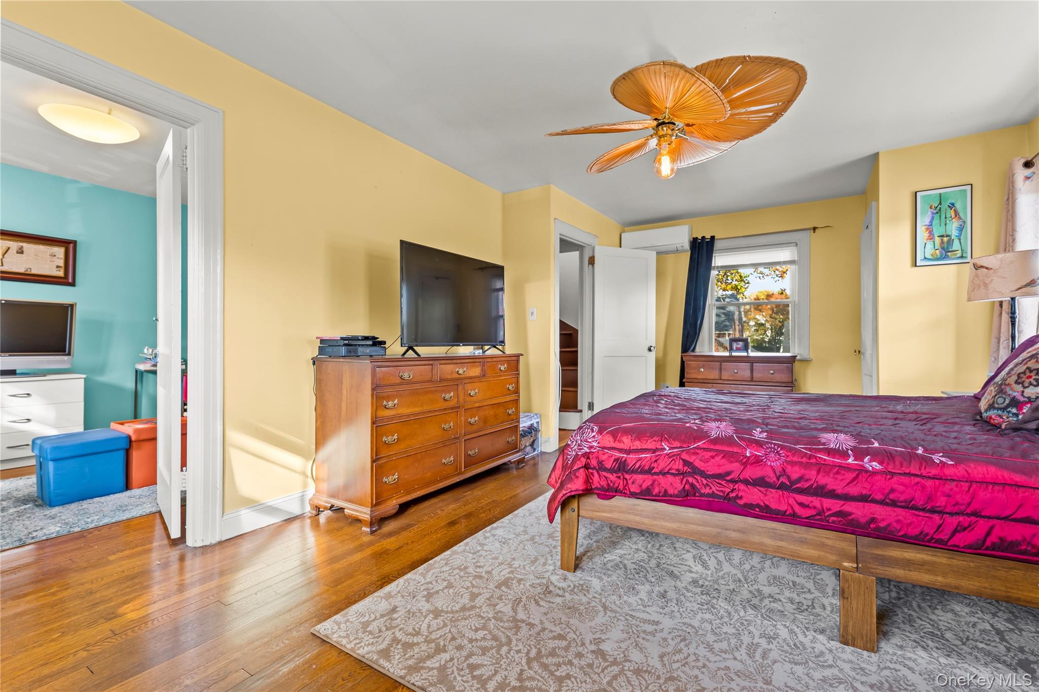 112-45 178th Street Queens, NY 11433 - Photo 14 of 24 a bedroom with a bed and wooden floor