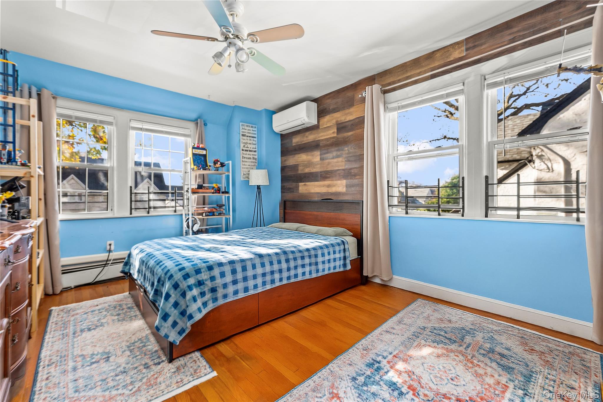 112-45 178th Street Queens, NY 11433 - Photo 16 of 24 a bedroom with a large bed and a large window