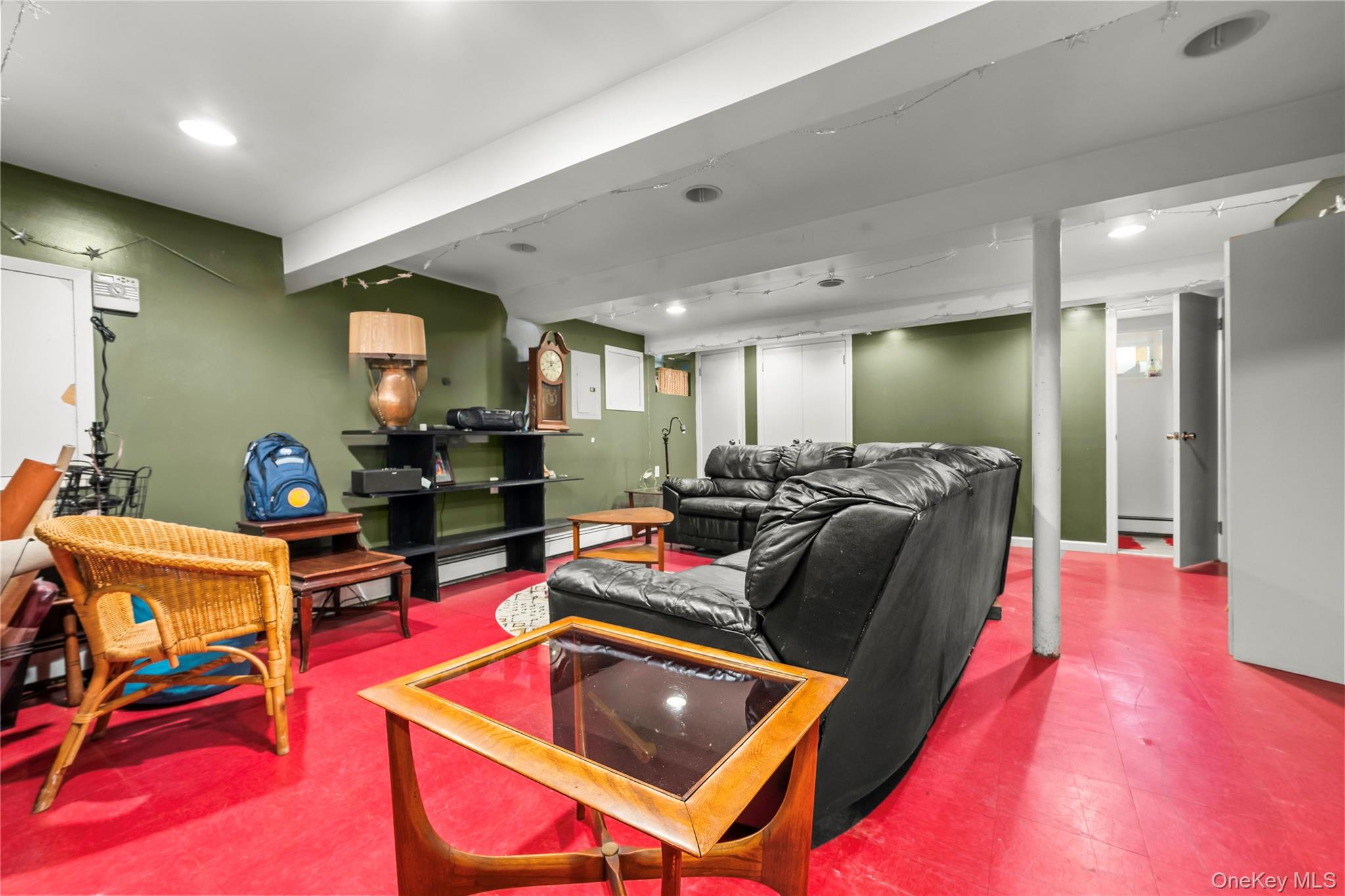 112-45 178th Street Queens, NY 11433 - Photo 19 of 24 a living room with furniture a rug kitchen view and a table