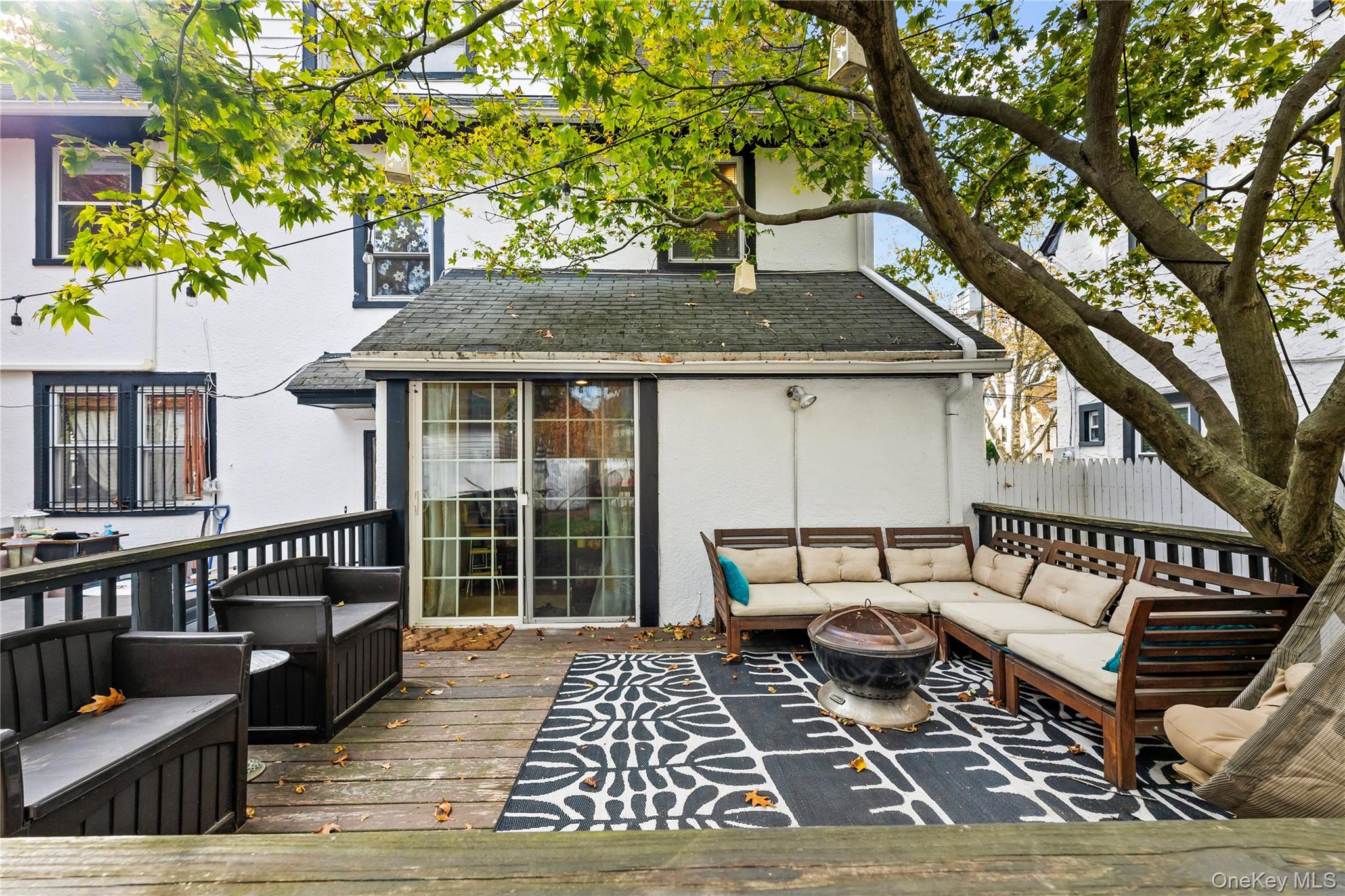 112-45 178th Street Queens, NY 11433 - Photo 20 of 24 a view of a house with wooden deck and furniture