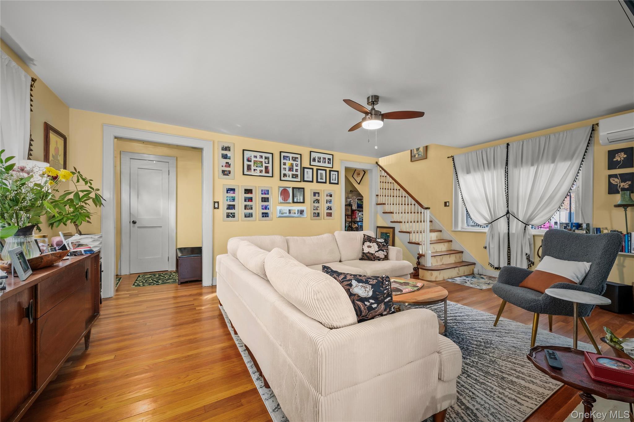 112-45 178th Street Queens, NY 11433 - Photo 4 of 24 a living room with furniture and a large window