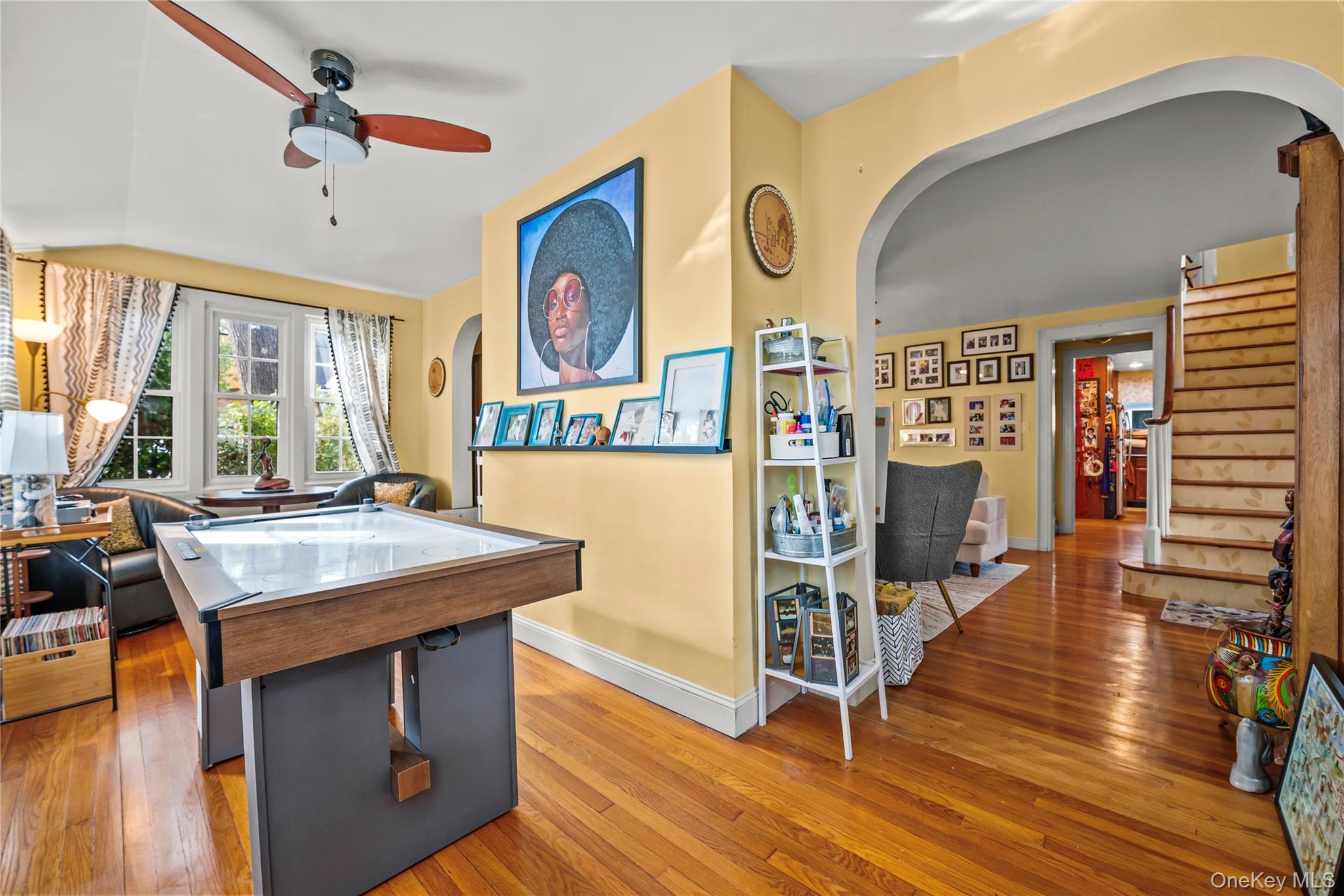 112-45 178th Street Queens, NY 11433 - Photo 6 of 24 a view of a kitchen with stainless steel appliances wooden floor and a table
