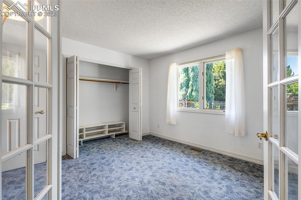 53 Sovereign Circle, Unit A Pueblo, CO 81005 - Photo 7 of 18 a view of an empty room with a window