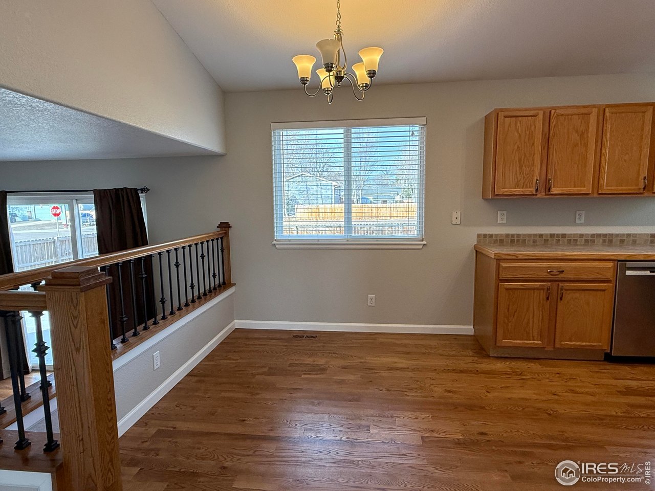 613 Sumac Street Frederick, CO 80530 - Photo 12 of 34 a view of entryway with wooden floor