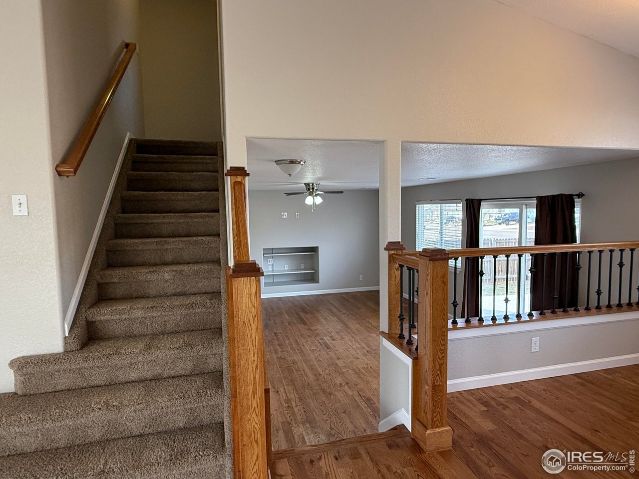 613 Sumac Street Frederick, CO 80530 - Photo 22 of 34 a view of entryway and hall with wooden floor