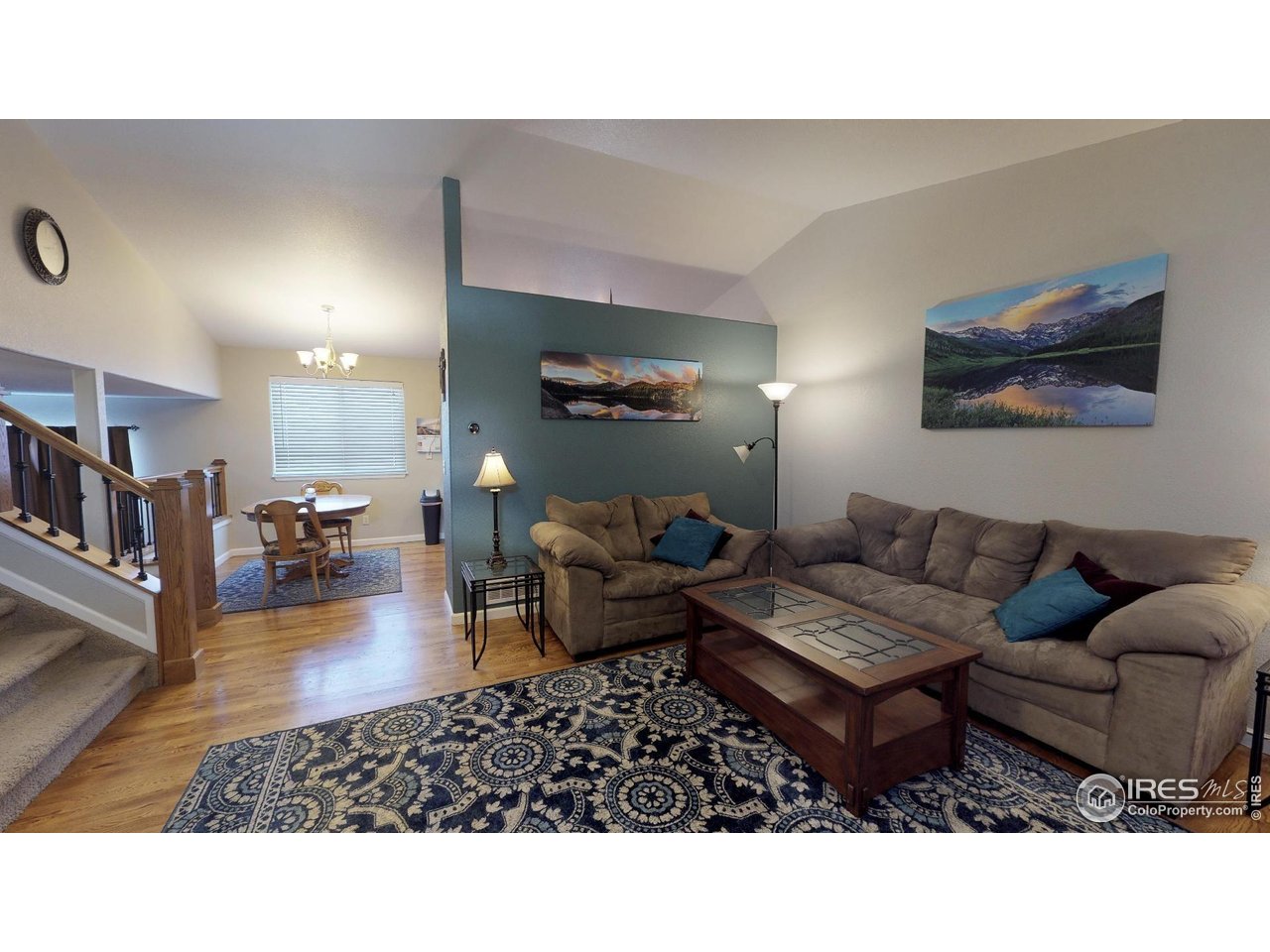 613 Sumac Street Frederick, CO 80530 - Photo 31 of 34 a living room with furniture and a wooden floor