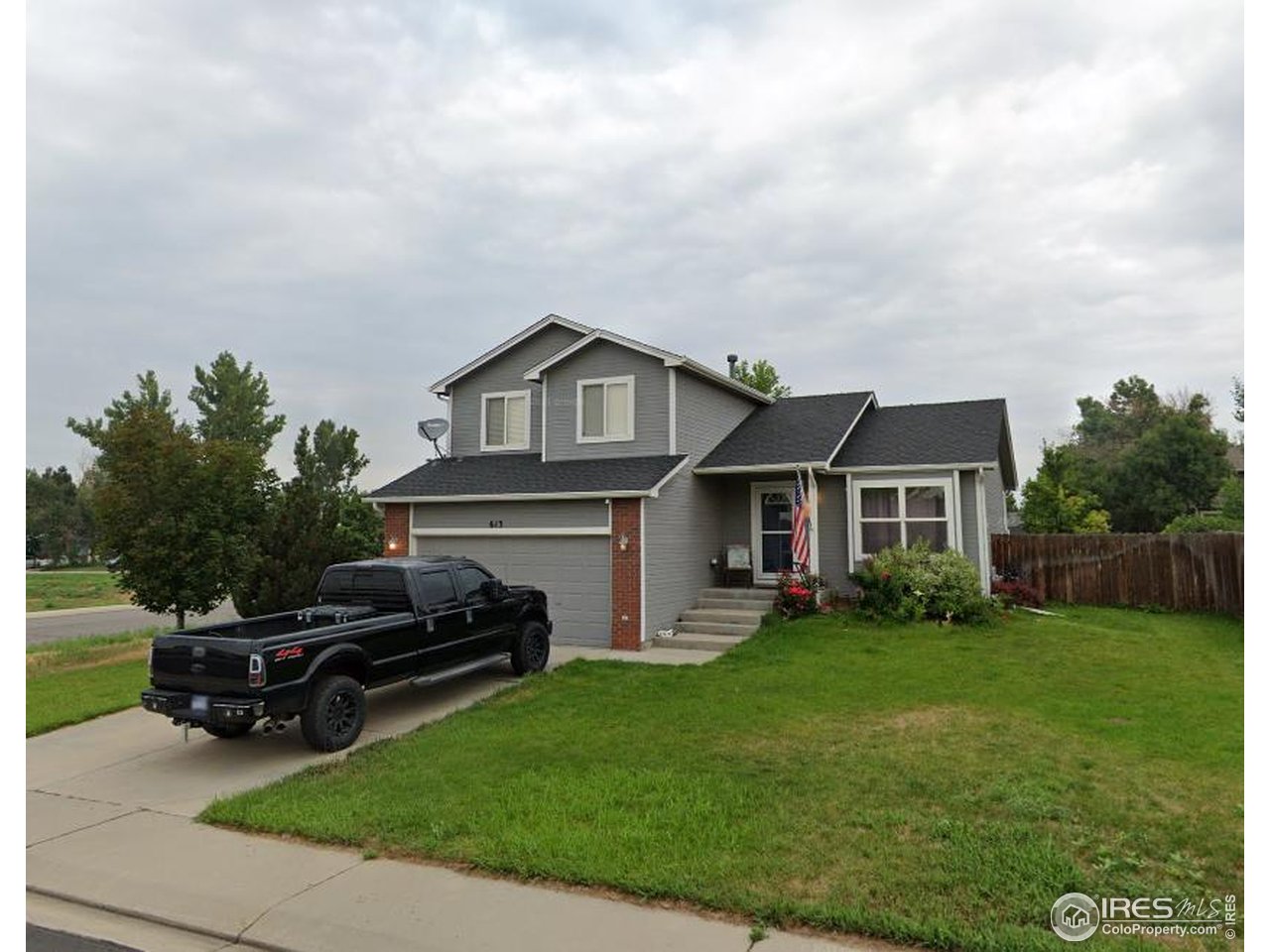 613 Sumac Street Frederick, CO 80530 - Photo 34 of 34 a view of a house with a big yard plants and large trees