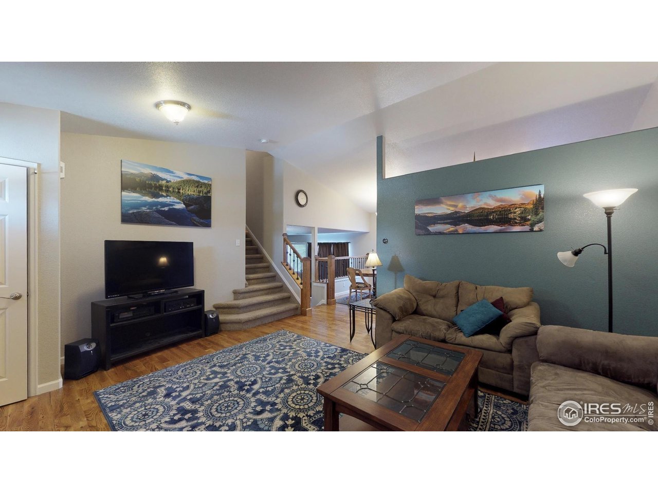 613 Sumac Street Frederick, CO 80530 - Photo 4 of 34 a living room with furniture and a flat screen tv