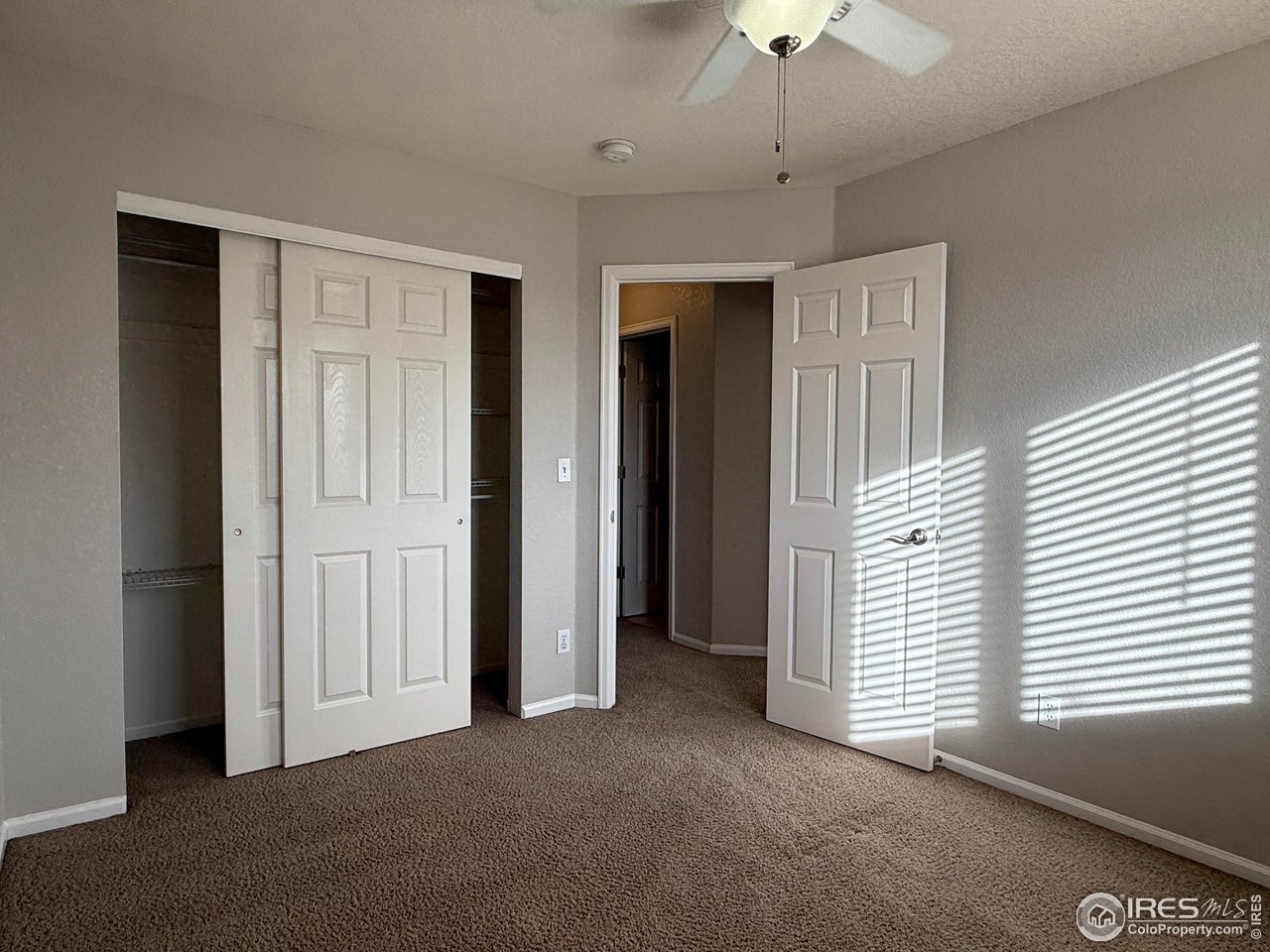 613 Sumac Street Frederick, CO 80530 - Photo 9 of 34 a view of empty room with a ceiling fan