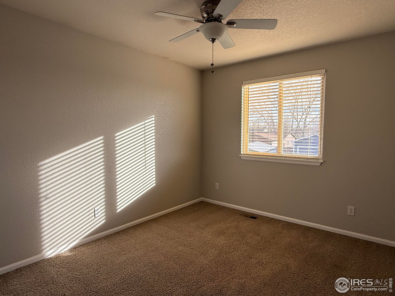 613 Sumac Street Frederick, CO 80530 - Photo 10 of 34 a view of an empty room with a window