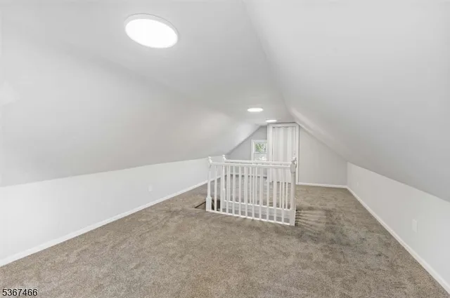 a view of a hallway with staircase