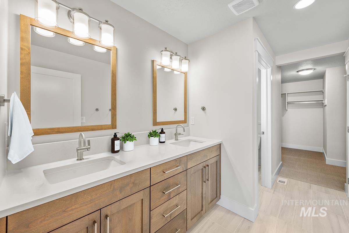 6983 South Skybreak Lane Meridian, ID 83642 - Photo 9 of 25 Full bath with a spacious closet and double vanity