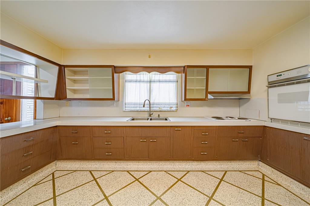 1316 Ridge Road Belle Vernon, PA 15012 - Photo 13 of 21 a view of a kitchen with a sink and cabinets