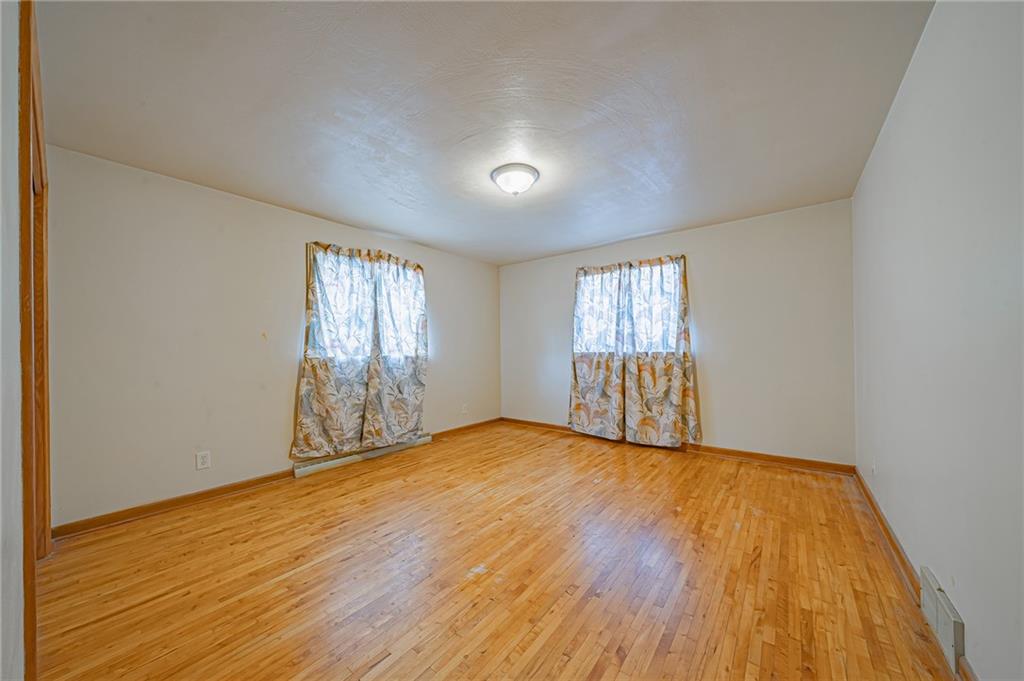 1316 Ridge Road Belle Vernon, PA 15012 - Photo 16 of 21 a view of empty room with wooden floor and fan